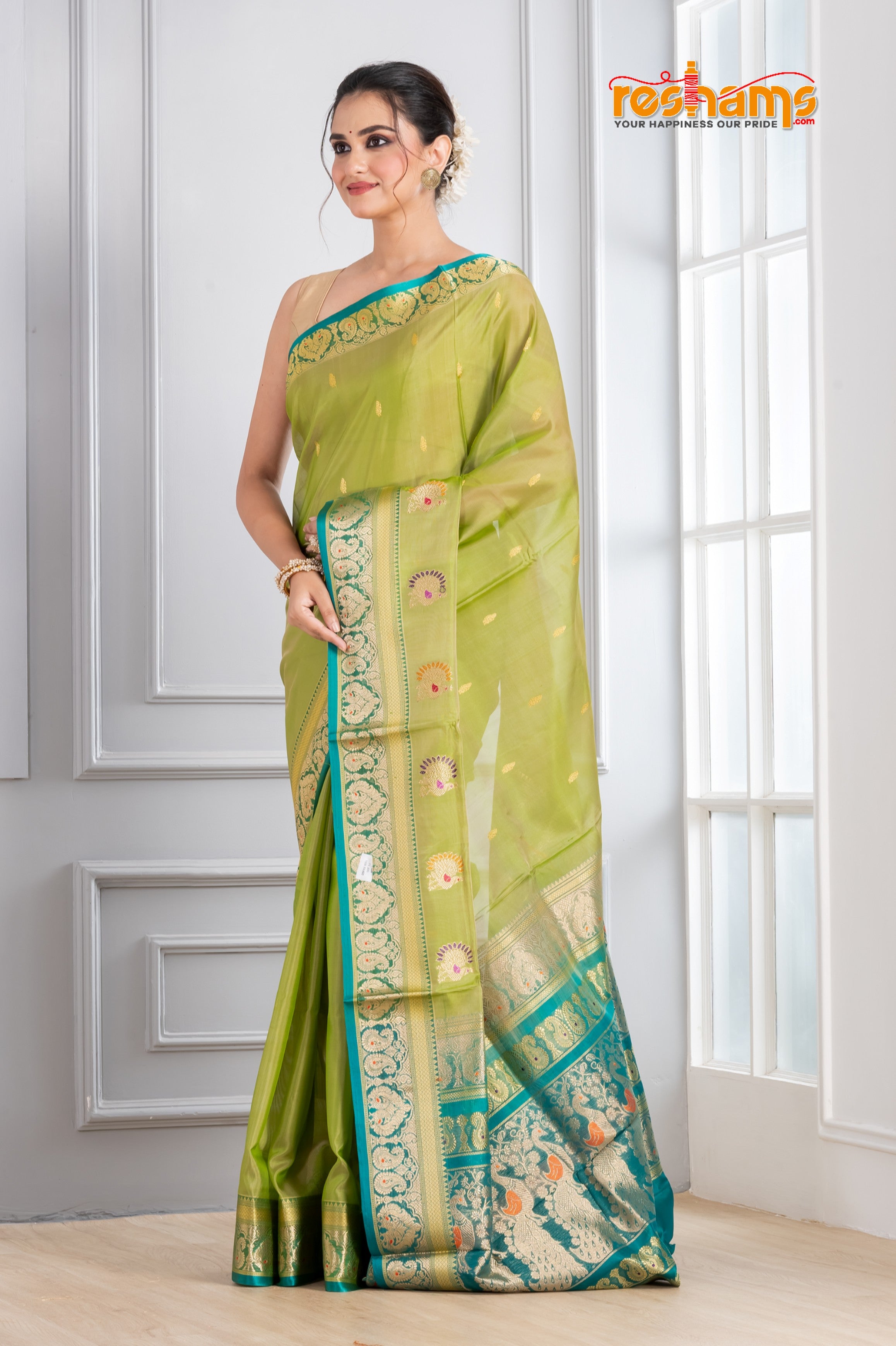 Pure Silk Paithani with green body with sea green Pallu