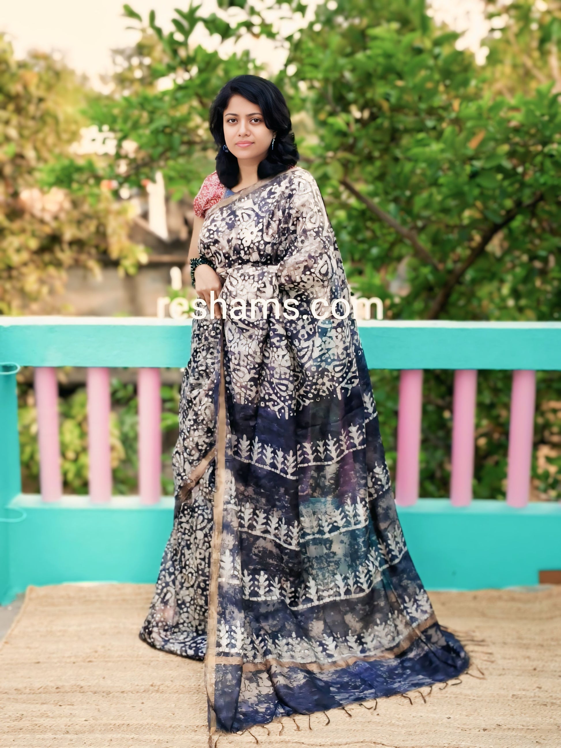 Liva Batik Print Linen Saree – Black Body with Golden Zari Border